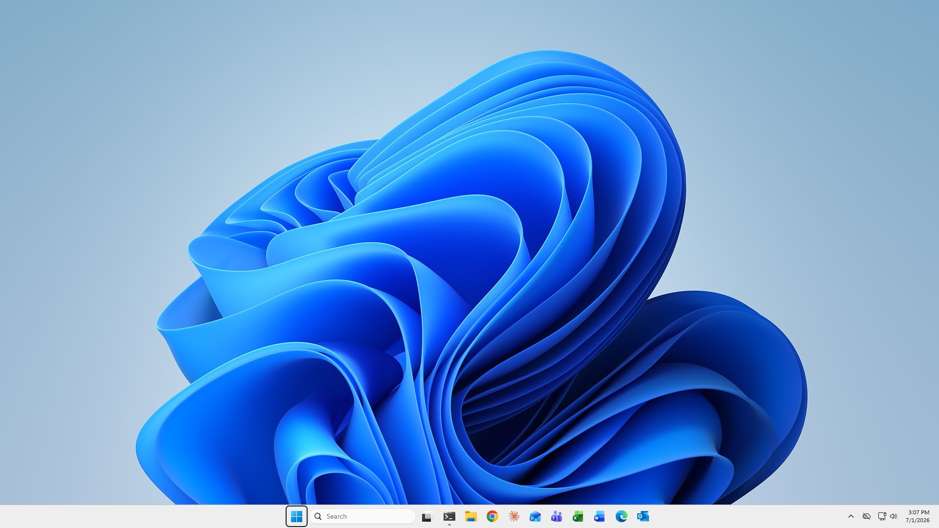 The desktop before the run: light theme, default blue Windows wallpaper, search box and a row of app icons in the taskbar
